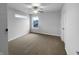 Bedroom with neutral carpet, a ceiling fan and a window letting in natural light at 6457 Flag Stop Dr, Whitestown, IN 46075