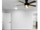 Clean bedroom featuring a ceiling fan, white walls, and access to an en-suite bathroom at 6457 Flag Stop Dr, Whitestown, IN 46075