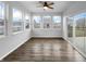 Light-filled sunroom with large windows, a ceiling fan, and sliding doors to the outside at 6457 Flag Stop Dr, Whitestown, IN 46075