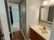 Half bathroom featuring a vanity and mirror, conveniently located near the main living areas at 7018 Allegan Dr, Indianapolis, IN 46217