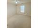 Neutral-toned bedroom offering ample space, comfortable carpeting and a bright window at 7018 Allegan Dr, Indianapolis, IN 46217