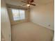 Bedroom with a ceiling fan and a window at 7018 Allegan Dr, Indianapolis, IN 46217