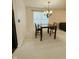 Cozy dining area with a chandelier and table, ideal for casual meals and entertaining guests at 7018 Allegan Dr, Indianapolis, IN 46217