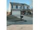 Charming two-story home featuring a two-car garage and a welcoming front porch at 7018 Allegan Dr, Indianapolis, IN 46217