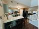 Kitchen view featuring a breakfast bar, stainless steel appliances, and access to the living room at 7018 Allegan Dr, Indianapolis, IN 46217