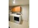 Dedicated laundry room with modern appliances and overhead cabinets for organized storage at 7018 Allegan Dr, Indianapolis, IN 46217