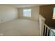 Open loft area with plenty of natural light, perfect for a home office or playroom at 7018 Allegan Dr, Indianapolis, IN 46217