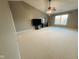 Spacious main bedroom features a large ceiling fan, a window, and neutral carpeting at 7018 Allegan Dr, Indianapolis, IN 46217