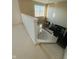 View from the top of the staircase to the kitchen and dining room at 7018 Allegan Dr, Indianapolis, IN 46217