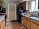 Functional kitchen with wood cabinets, modern appliances, and a door to the outside at , Monrovia, IN 46157