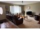 Cozy living room featuring plush seating, a large window with curtains, and a television at , Monrovia, IN 46157