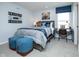 Comfortable bedroom featuring a decorative football theme, stylish furnishings and natural light at 7348 Deerberg Dr, Indianapolis, IN 46259