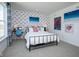 Bright and airy bedroom featuring colorful art, modern decor, and a comfortable desk area at 7348 Deerberg Dr, Indianapolis, IN 46259