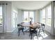 Bright and airy dining area featuring a round wooden table and plenty of natural light at 7348 Deerberg Dr, Indianapolis, IN 46259