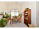 Bright dining room featuring a wooden table, chairs, and natural light, perfect for Gathering meals at 8221 Furlong Cir, Indianapolis, IN 46256