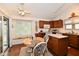 Cozy kitchen with wooden cabinetry, tile countertops, and a breakfast nook, ideal for casual dining at 8221 Furlong Cir, Indianapolis, IN 46256