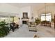 Inviting living room with a fireplace, large windows, and comfortable seating, creating a cozy atmosphere at 8221 Furlong Cir, Indianapolis, IN 46256