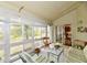 Bright sunroom featuring a sitting area, windows, and natural lighting at 8221 Furlong Cir, Indianapolis, IN 46256