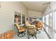 Enclosed sunroom with outdoor furniture, multiple windows, and natural lighting at 8221 Furlong Cir, Indianapolis, IN 46256