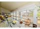 Bright sunroom filled with natural light, comfortable seating, and serene views, perfect for relaxation at 8221 Furlong Cir, Indianapolis, IN 46256