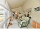 Relaxing sunroom featuring comfortable seating, with serene views of the surrounding landscape at 8221 Furlong Cir, Indianapolis, IN 46256