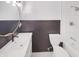 Updated bathroom with subway tile, modern vanity, and black accents at 9318 Drawbridge Ct, Indianapolis, IN 46250
