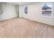 Spacious bedroom with large windows, neutral carpet and a closet at 9318 Drawbridge Ct, Indianapolis, IN 46250