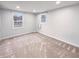Cozy bedroom with neutral carpet, recessed lighting and bright windows at 9318 Drawbridge Ct, Indianapolis, IN 46250