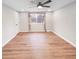 Spacious bedroom features wood flooring, a ceiling fan, and a window offering natural light at 9318 Drawbridge Ct, Indianapolis, IN 46250