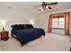 A spacious bedroom featuring neutral carpet and a window with curtains at 10120 Youngwood Ln, Fishers, IN 46038