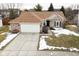 Charming single-Gathering home with a brick facade, attached garage, and well-maintained lawn at 10120 Youngwood Ln, Fishers, IN 46038