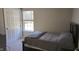 Bright bedroom with a window, closet, neutral paint, and carpet, offering a comfortable and relaxing space at 10645 Aspen Dr, Fishers, IN 46037