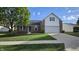 Charming single-Gathering home featuring brick accents, a two-car garage, and a well-maintained lawn at 10645 Aspen Dr, Fishers, IN 46037