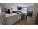 Open-concept layout connecting kitchen with a center island to the cozy living room with a fireplace at 10645 Aspen Dr, Fishers, IN 46037