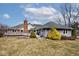 Spacious backyard showcasing the home's architectural details and outdoor living space with a chimney at 10651 E County Road 600 N, Indianapolis, IN 46234
