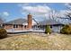 Spacious backyard showcasing the home's architectural details and outdoor living space with a deck at 10651 E County Road 600 N, Indianapolis, IN 46234