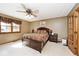 This bedroom features a ceiling fan and a comfortable-looking bed, perfect for a relaxing night's sleep at 10651 E County Road 600 N, Indianapolis, IN 46234