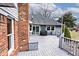Spacious deck with brick and siding details, ideal for outdoor relaxation and entertaining at 10651 E County Road 600 N, Indianapolis, IN 46234