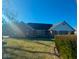 Charming red brick home with a well-maintained lawn and tidy landscaping, offering a welcoming curb appeal at 10651 E County Road 600 N, Indianapolis, IN 46234