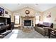 Cozy living room with stone fireplace and comfortable seating, perfect for relaxing at 10651 E County Road 600 N, Indianapolis, IN 46234