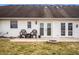 Backyard patio with outdoor seating, a fire pit, and green lawn at 1114 Northfield Ln, Anderson, IN 46011