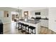 Modern kitchen with an island, stylish bar stools, and contemporary appliances at 11808 Vale St, Indianapolis, IN 46235
