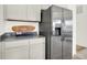 Modern kitchen featuring stainless steel refrigerator, light cabinets, and attractive countertops at 11808 Vale St, Indianapolis, IN 46235