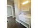 Bathroom vanity with a white marble countertop, stylish cabinetry, and chrome hardware at 1206 Dawson St, Indianapolis, IN 46203