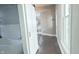 Hallway view featuring a white bathroom with subway tile and a modern standalone tub at 1206 Dawson St, Indianapolis, IN 46203