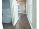 Hallway view of a modern bathroom featuring a freestanding tub with subway tile backsplash at 1206 Dawson St, Indianapolis, IN 46203