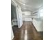 Kitchen with new cabinets, subway tile, stainless appliances, and barn door to the bathroom at 1206 Dawson St, Indianapolis, IN 46203
