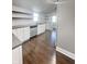 New kitchen featuring white cabinets, subway tile backsplash, stainless appliances, and dark wood floors at 1206 Dawson St, Indianapolis, IN 46203