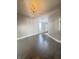 Spacious living room with hardwood floors, grey walls, and decorative lighting at 1206 Dawson St, Indianapolis, IN 46203