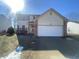 Charming two-story home with a two-car garage, red shutters, and a well-maintained front yard at 12151 Bearsdale Dr, Indianapolis, IN 46235